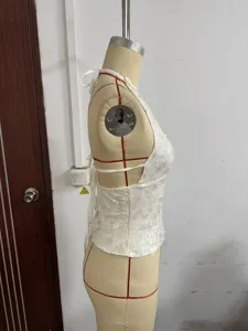 Detailed side view of a sexy white sequin halter backless sleeveless top for women.
