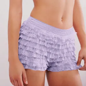 Close-up detail of light purple tiered ruffle shorts featuring soft low-waist design.
