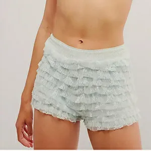 Detailed view of light green ruffled mesh shorts, low waist Lolita bloomers style.