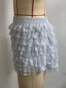 Close-up detail of light blue tiered lace ruffled skort, showcasing layered mesh and elastic waist.