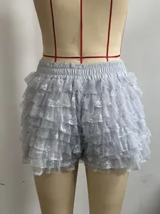 Details view of solid color lace tiered ruffle low-waist Lolita shorts for women summer beach wear.