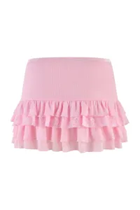 Pink ribbed low-waist mini skirt featuring layered ruffles and delicate lace trim design.