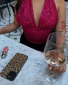 Close-up detail of the glitter halter neck sequin camisole top showcasing shiny fabric texture.