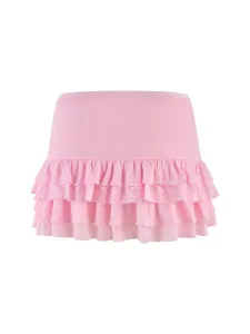 Pink tiered ruffle mini skirt with lace trim and ribbed waistband for cute Y2K fashion look.