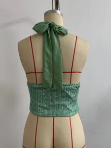 Green sequin halter backless cami top detail view showcasing the elegant bow tie design.