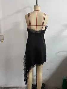 Detail view of the black lace camisole dress showcasing elegant irregular lace hem.