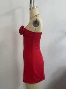 Close-up display showing the side silhouette and delicate 3d rose chest detail of the red dress.