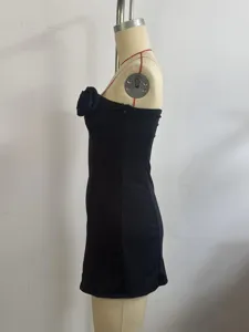 Black strapless mini dress side view showcasing the elegant 3D rose flower bust detail.