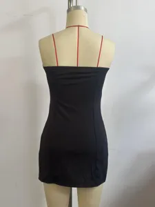 Detail view of the back of a black strapless mini slip dress, showing slim fit and design.
