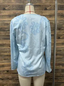 Back detail of the light blue long sleeve floral printed slim fit casual top showcasing style.