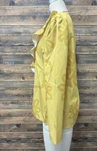 Yellow long sleeve floral textured blouse with ruffled V-neck detail, elegant side view.