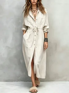 Beige drawstring waist shirt dress detail showing collar, button front, and long sleeves.
