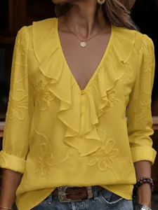Elegant yellow V-neck long sleeve blouse featuring delicate floral embroidery and ruffle trim.
