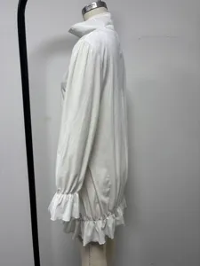 Close-up side view of white crystal velvet long sleeve dress showing ruffle collar detail.