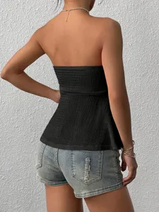 Detailed back view of sexy black strapless smocked tube top with stylish ruffled hem.