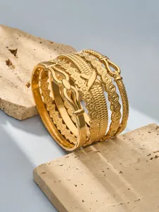 Exquisite gold plated stainless steel stacked bracelets showcasing intricate floral and geometric details.