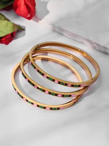 Detailed view of stainless steel gold-plated bangle bracelets featuring colorful square stones.