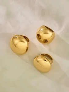 Gold geometric teardrop statement ring, chunky polished metal retro finger jewelry detail.
