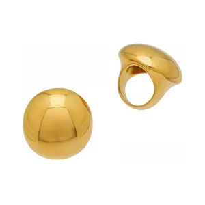 Chic chunky gold-plated dome ring and sphere set, statement geometric aesthetic jewelry.