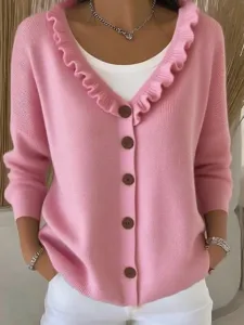 Detailed view of the stylish pink v-neck cardigan sweater with cute ruffle collar and buttons.