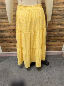 Yellow floral tiered long skirt for women, casual summer beach vacation maxi skirt style.