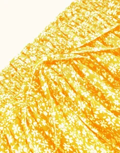 Detailed view of women's yellow floral print elastic smocked waist skirt with adjustable drawstring.