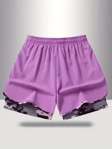 Women's purple athletic shorts with double layer anti-glare and elastic waist design.