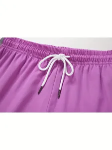 Close up of purple women sports shorts elastic drawstring waist detail summer casual apparel.