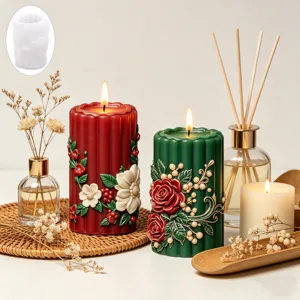 Detailed shot of embossed flower silicone candle mold with finished red and green candles.