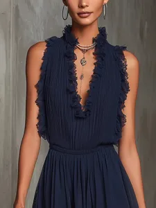Elegant dark blue sleeveless pleated mini dress with lace trim and deep V-neck style.