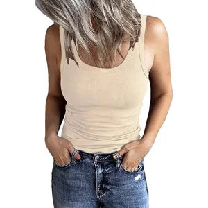 Close-up detail of women sleeveless ribbed slim fit basic tank top in solid beige color style.