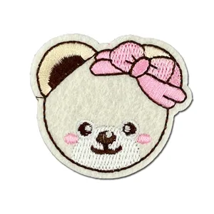 Cute cartoon bear embroidery patch with pink bow, white felt fabric for kids clothing decor.