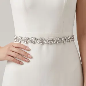 Detailed shot of a gorgeous rhinestone bridal belt with sparkling crystal flower designs.