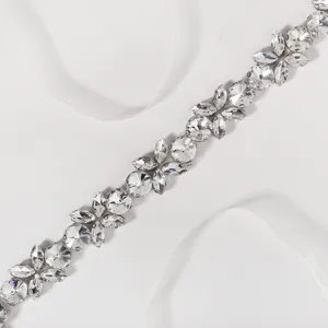 Exquisite rhinestone crystal bridal belt detail, sparkling diamond wedding dress fashion accessory.