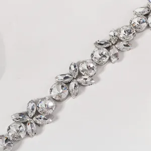 Close-up detail of luxury crystal rhinestone decorative waist belt trim sparkle accessory.