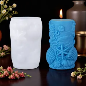 Detailed view of marine element silicone mold and blue candle with seashell and starfish.