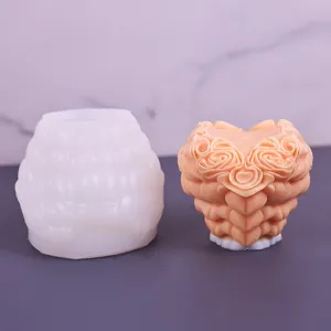 Close-up detail of heart-shaped rose silicone mold and finished candle craftsmanship showcase