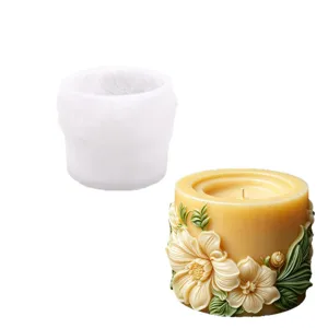 Cylindrical silicone mold featuring blooming floral and leaf relief designs for aromatherapy candles.