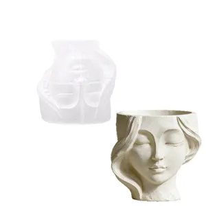 Moule en silicone et pot de fleurs en platre fini avec visage de femme pour bricolage.