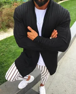 Detail shot of men's black ribbed knit cardigan featuring open front and long sleeves.