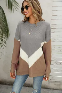 Detailed view of the stylish color-block knit sweater showcasing cozy fabric and sleeves.