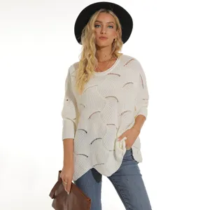 Stylish women's white hollow-out batwing sleeve knit sweater for autumn and winter fashion.