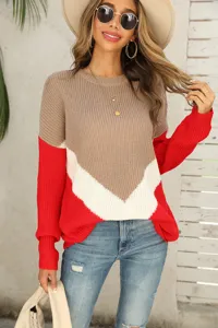 Detailed close-up of women's color-block knit sweater featuring drop shoulder design.