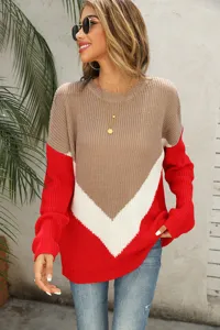 Detailed shot of the stylish color-block sweater featuring cozy knit fabric and drop shoulders.