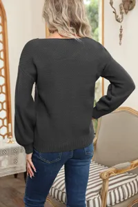 Women's solid color long sleeve knitted sweater back view detail shot for autumn winter.