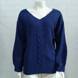 Close-up detail of the dark blue women's V-neck cable knit sweater showcasing fine texture.