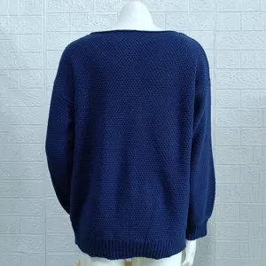 Back detail view of a solid dark blue women long sleeve knit sweater with ribbed hem.