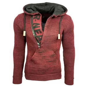 Close-up detail of men's knitted hooded sweater, ribbed texture with half-zip design.
