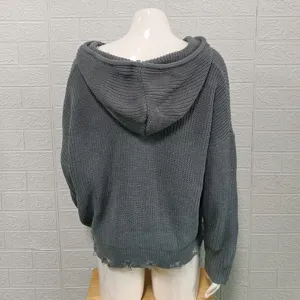 Back view detail of women solid grey knitted hooded cardigan showing distressed hem design.
