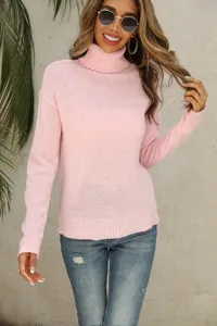 Detailed view of the cozy pink turtleneck knit sweater with long sleeves for autumn styling.